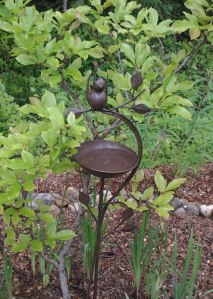Again, whimsy in metal. This bird looked very steampunk to us so - we HAD to have it. the sprinkler head peeks out from the top of his tail. And the bowl serves as an auxiliary water source for the birds that visit us. 